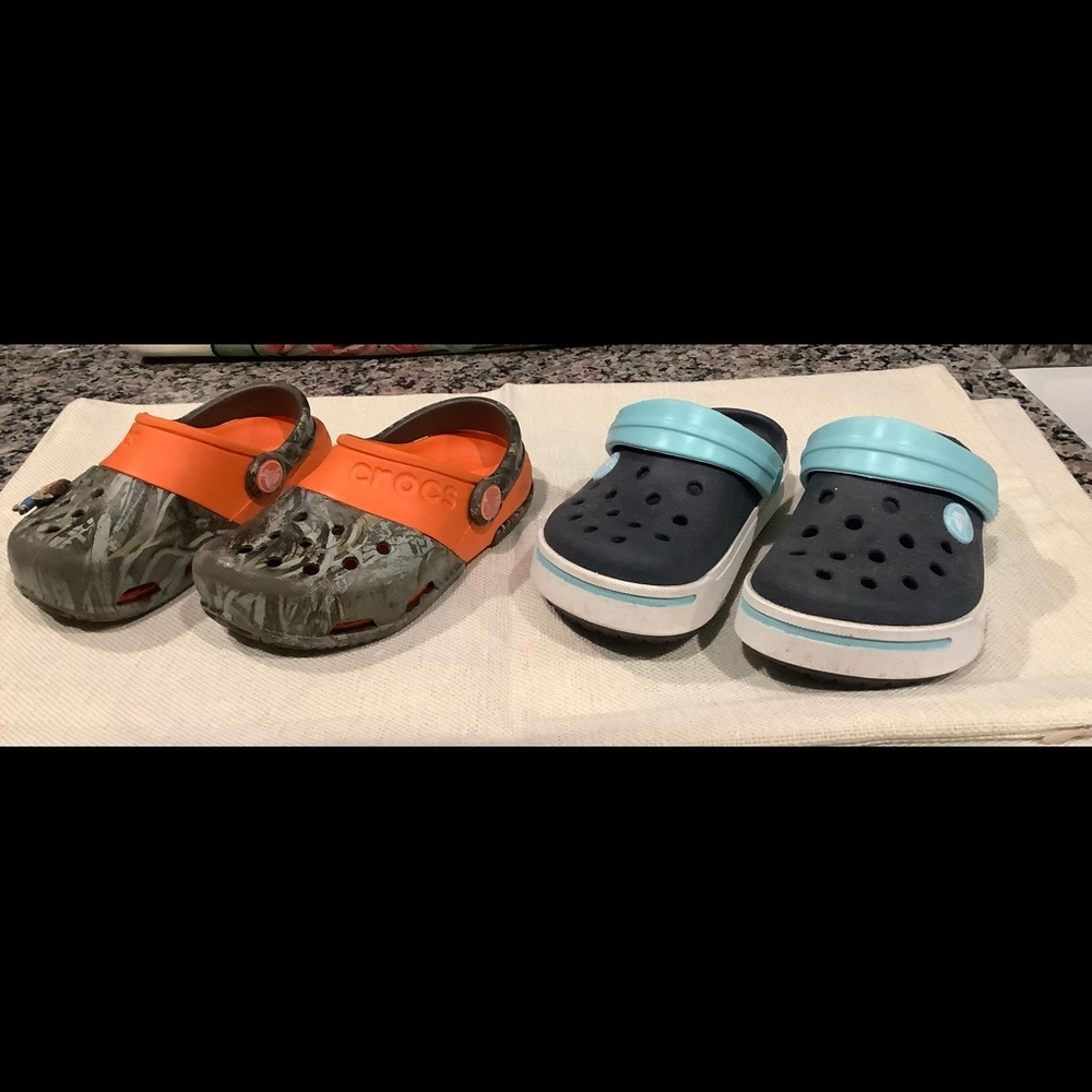 Gently worn boys crocs. One is blue and other is camo.  Selling both for $20